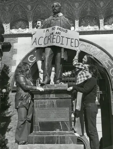 Students celebrating the College's 1973 accreditation 