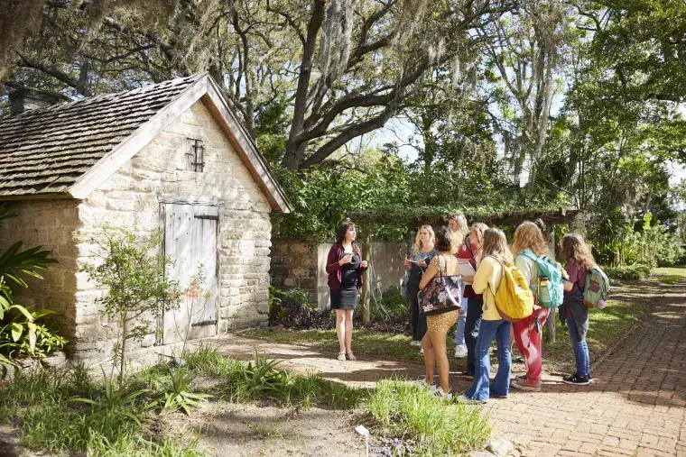 A group of students learns outside in historic downtown St. Augustine.