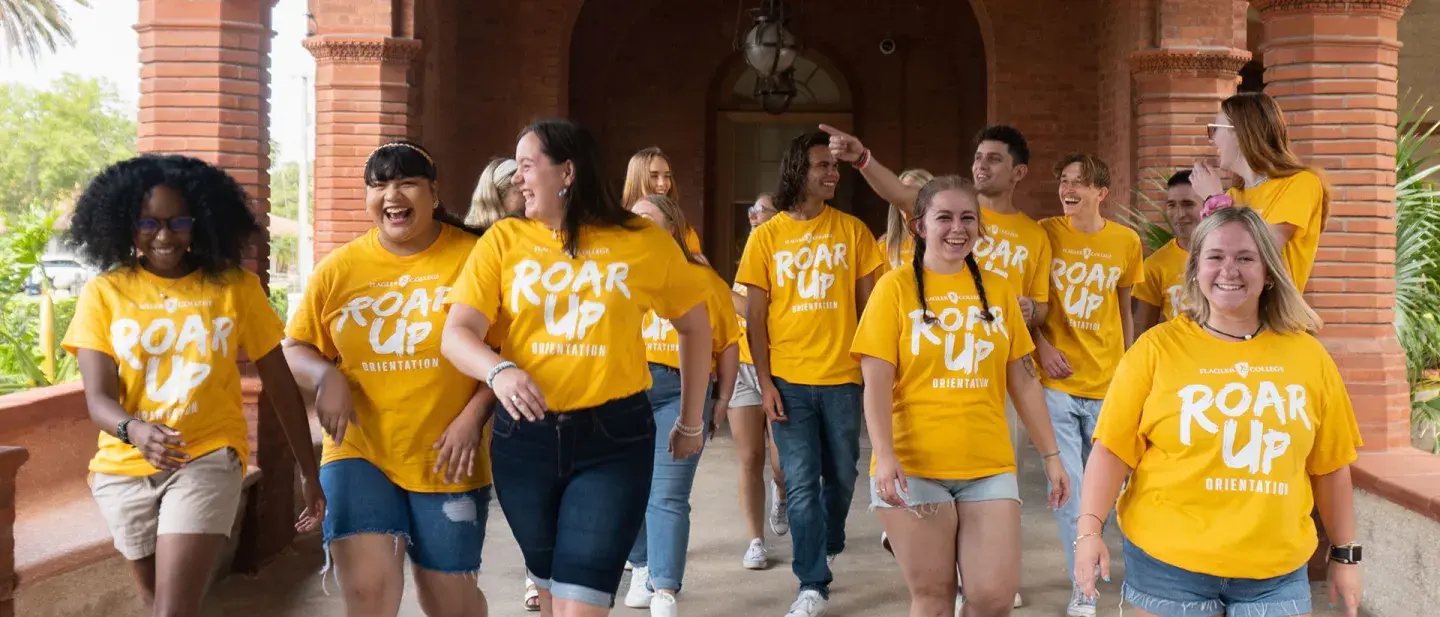 Student orientation leaders walking together in the courtyard of Ponce