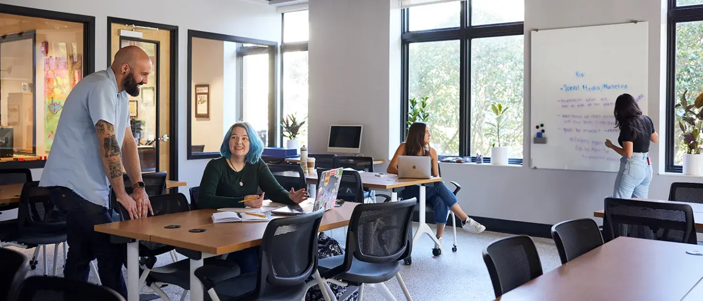 Professor speaking to students in the Brown Innovation Center