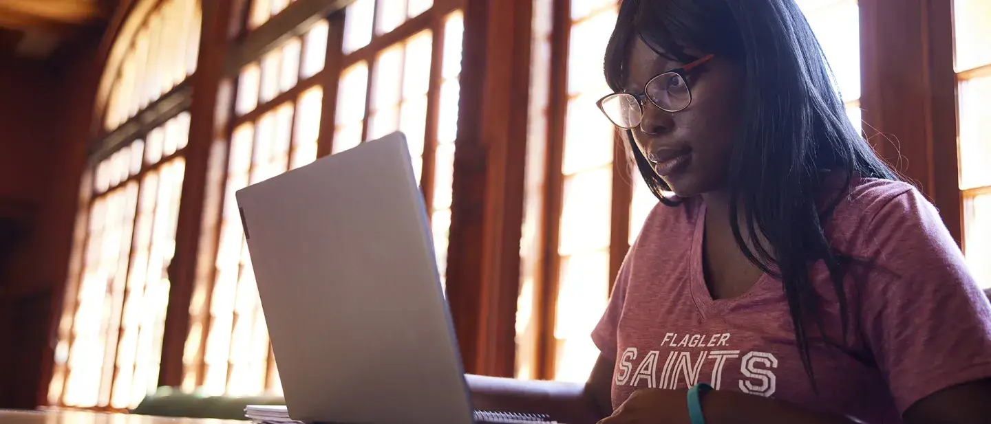 Student looking at her laptop