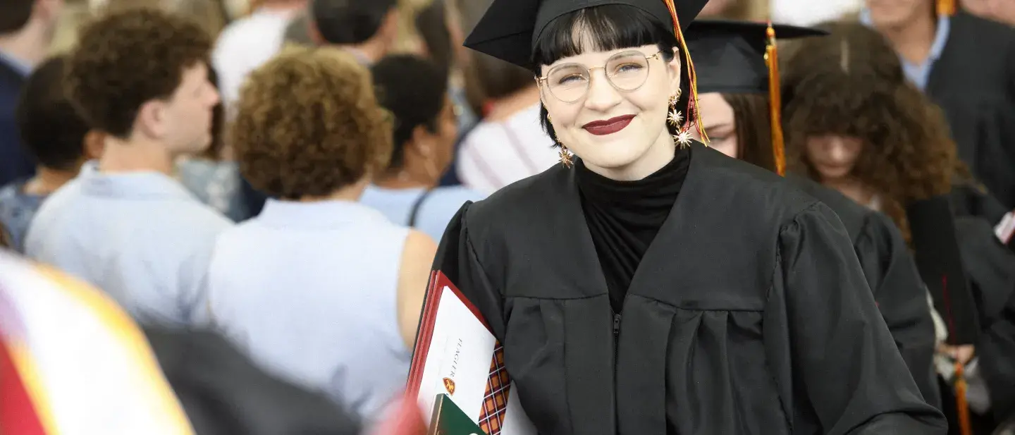 Student smiling at Graduation