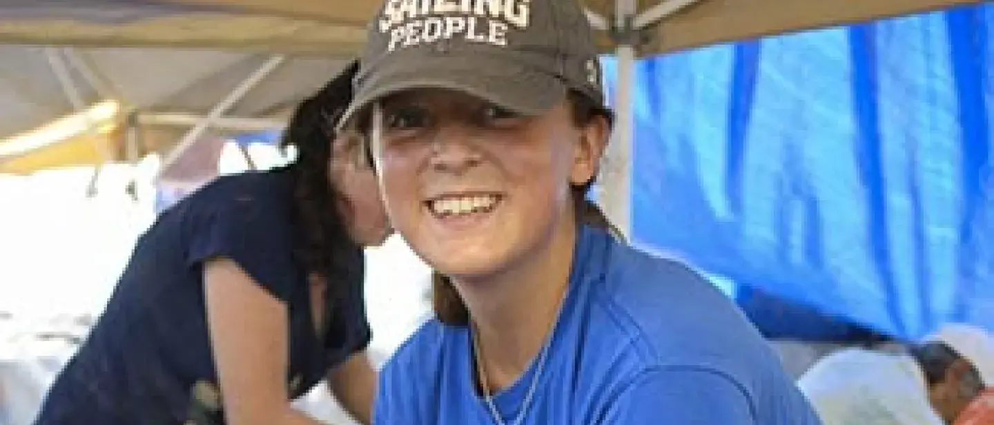 A student smiles.