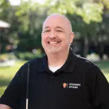 Flagler College staff member Phil Pownall is shown.