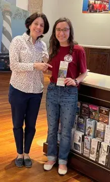 Dr. Darien Andreu and Presleigh Johnson with the walking tour brochures at the Visitor Information Center. )