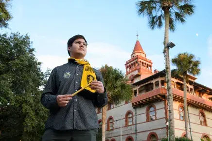 A Flagler College student holds a wand during Harry Potter week.