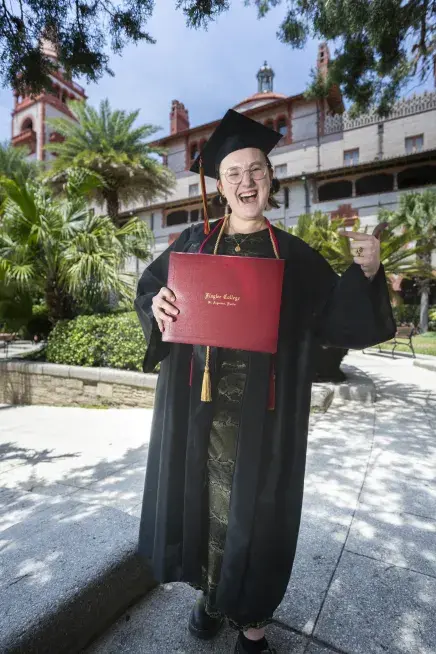 Helena holding diploma