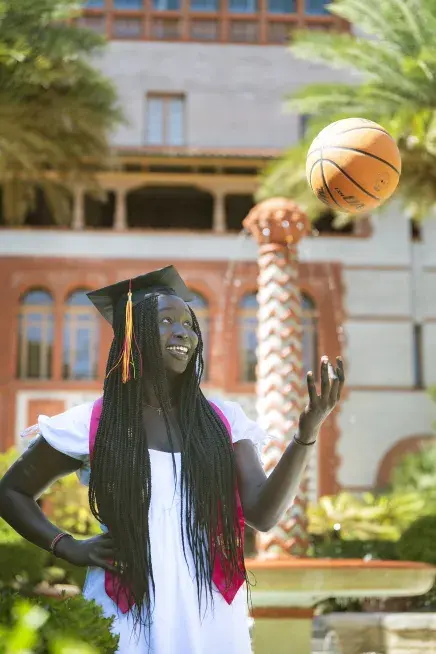 Amuk tossing basketball in the air