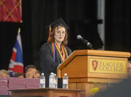 Helena Rodriguez at Commencement podium