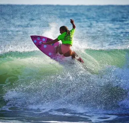 Maggie Demsey on the waves