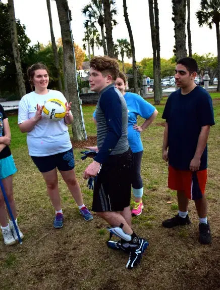 Rhodes in Palm Garden with team