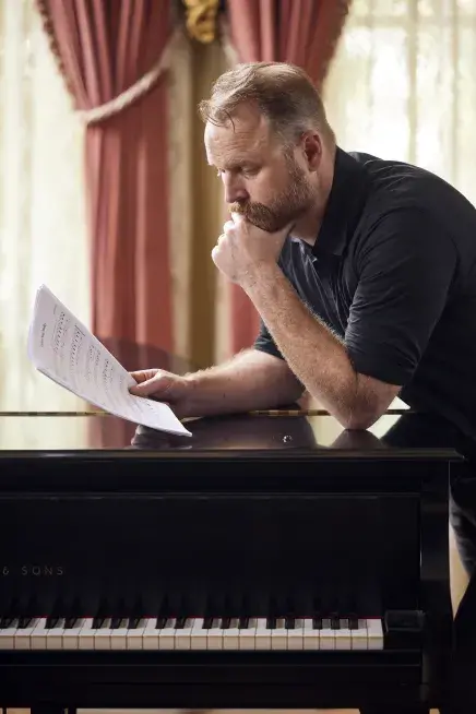 Taisey pondering sheet music in Flagler Room (MindPower)
