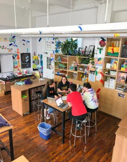 Emily working with students in classroom