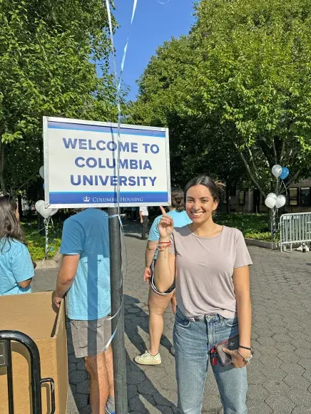 Fernanda with "Welcome to Columbia University" sign