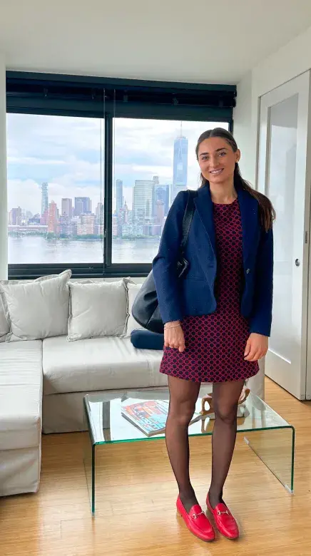 Merietta posing in apartment with NYC view