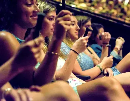 Students holding FEC spike during Convocation ceremony