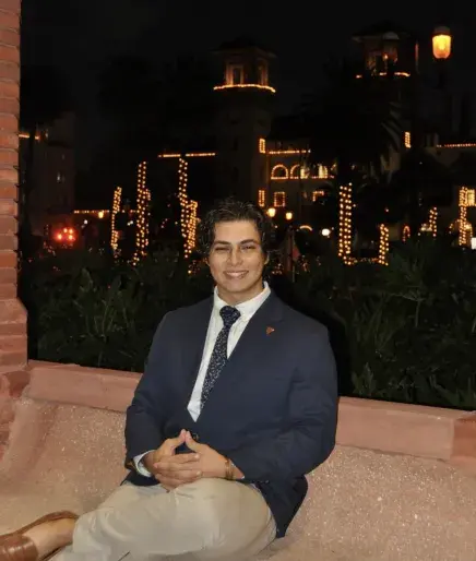 Rowen Rivera poses for a photo with the city of St Augustine in the background
