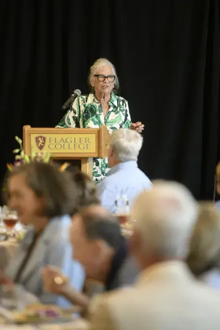 Janet English addressing the crowd during her award acceptance speech