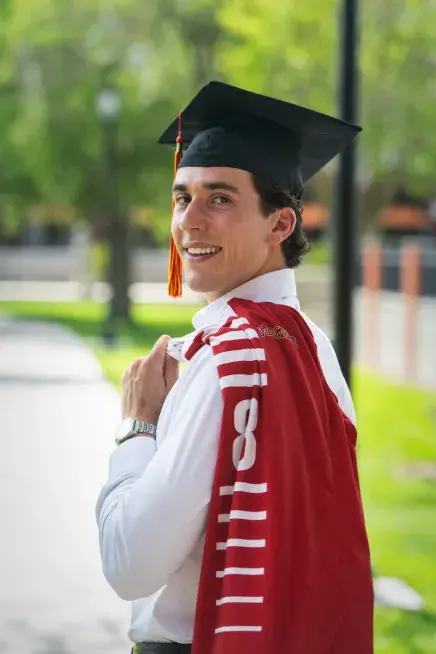 Jesse Van Krimpen looking back at the camera with his soccer jersey over his shoulder
