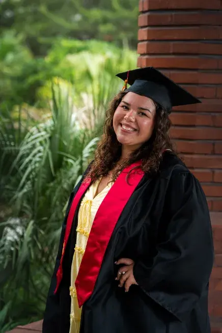 Mia Melendez posing in her cap and gown