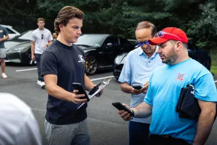 Logan Sarosi having a converstion at one of his car club events
