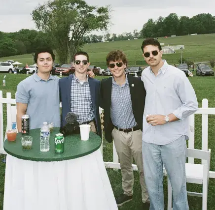 Logan Sarosi With Friends at a car and horse racing event