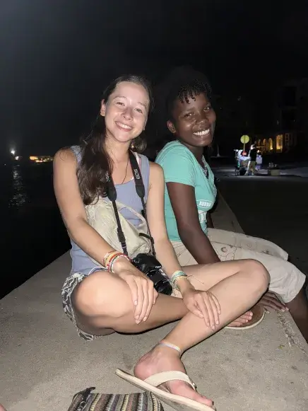 Sophia Cardona sits with a member of the community she stayed with in Cuba