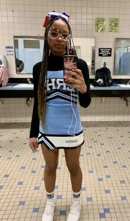 Temia Hayes in her high school cheerleading outfit