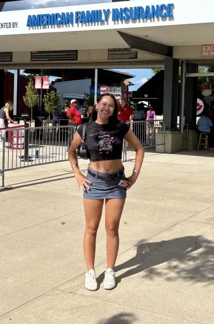 Chloe Fenninmore stands outside a concert venue