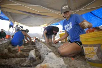 Flagler College students work at a dig site.