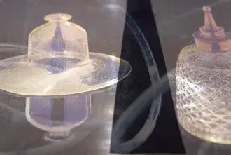 Frame from the video for the Harris-Babou exhibit showing various ceramic objects that act as receptacles for breast milk.