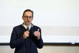 Rob Jackson speaking in front of a crowd