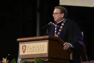 President Delaney wearing Chain of Office at past Commencement