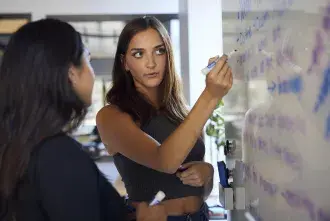 A student at a white board.