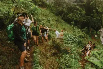 Students walking through hills in Tanzania