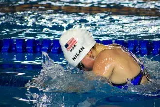 Flagler student Maddie Nilan swimming in the 2022 Deaflympics for team USA