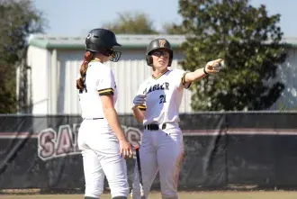 Emily Ricci directs her teammate as captain of the Flagler softball team
