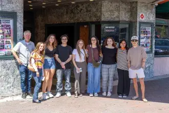 A group of students pose for a photo following a day of ad agency tours