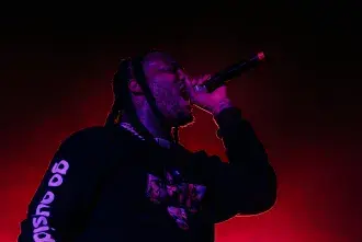 Waka Flocka rapping into the mic at Flagler Fest