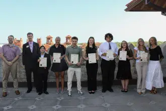 the eleven students who make up the inaugural Kappa Mu Epsilon academic society