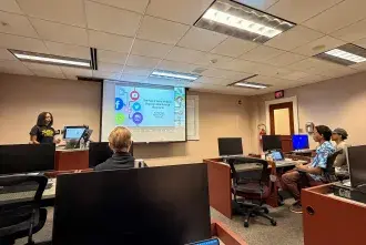 Student Jazmine Major presents to her class in St Augustine, and virtually in China