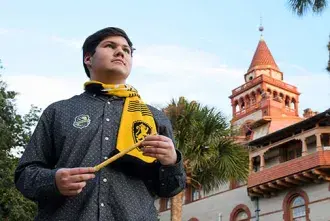 HPW 2022 - Student standing in front of the Ponce wearing Harry Potter attire.
