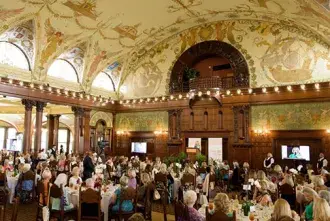 A wide shot of Power of the Purse attendees in the Ponce Dining Hall