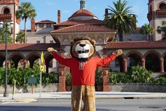 Lewis the Lion poses outside Flagler College
