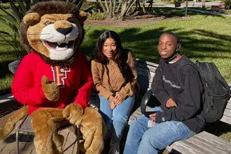 Lewis the Lion was all smiles as he welcomed new Saints to campus