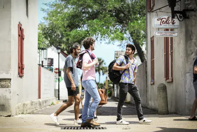 Students walking with friends down St. George Street 