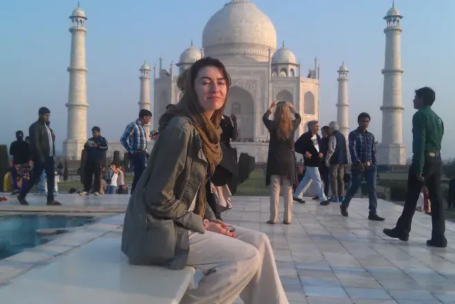Woman in front of India's Taj Mahal.