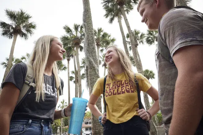 Group of students talking in the Palm Garden