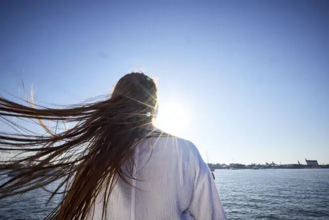 Student Overlooking the Water