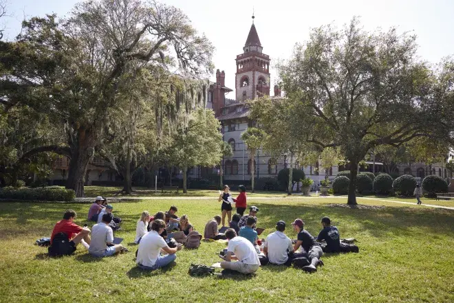 Class being taught outside in the West Lawn with Ponce Tower in the Background